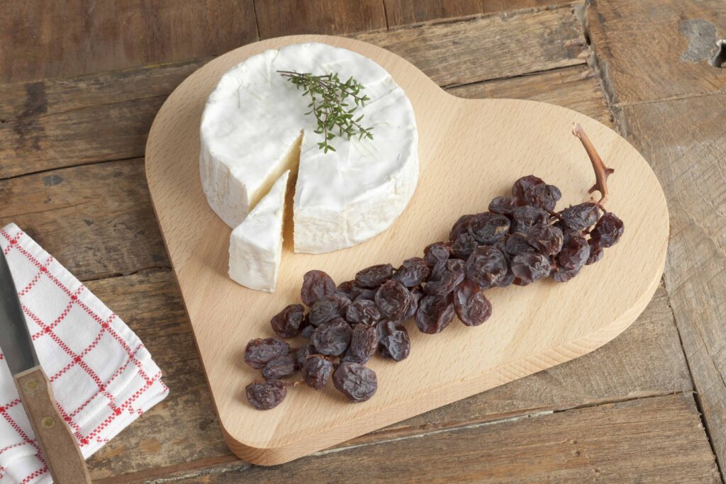 heart shaped wooden charcuterie board used for valentines dessert