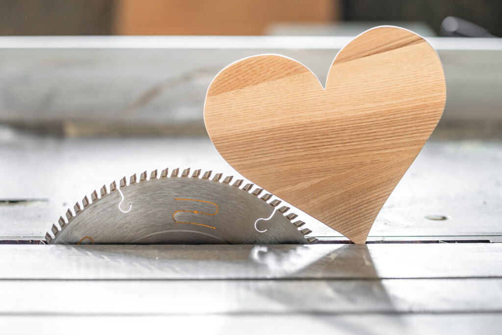 handmade wooden valentine heart crafted in woodworking shop

